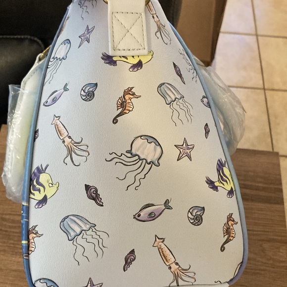 Ariel, sitting under moon satchel, lounge, fly purse - Picture 11 of 11